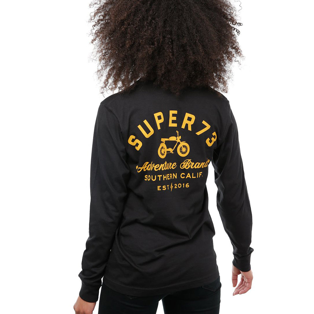 Back view of female model in Black Adventure Long Sleeve T-Shirt on white background.