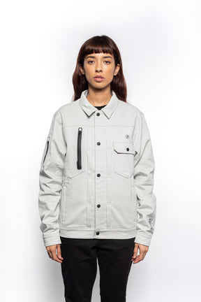 Female model wearing Anvil Chore Jacket in chalk colorway.