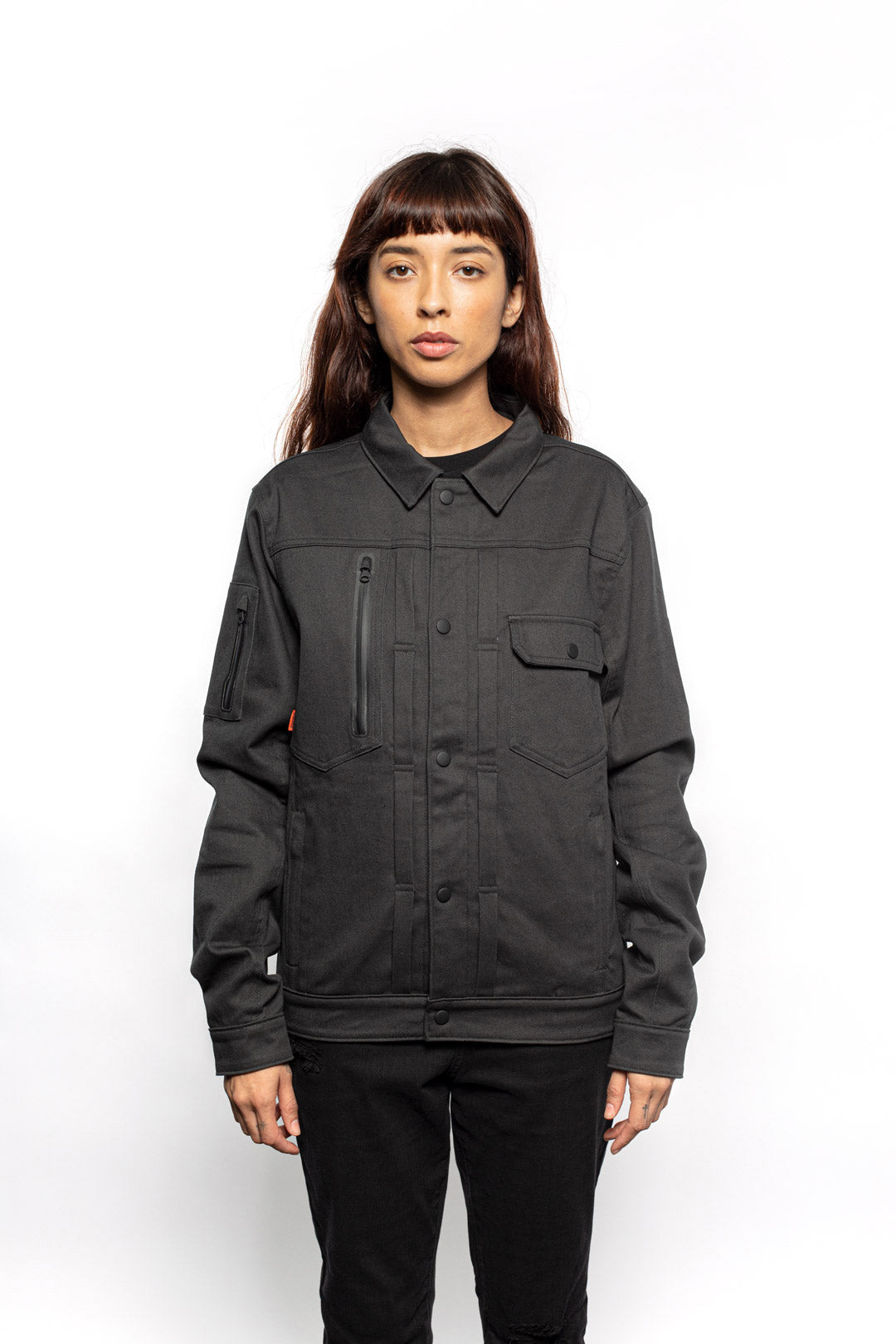 Female model wearing Anvil Chore Jacket in gravel colorway.