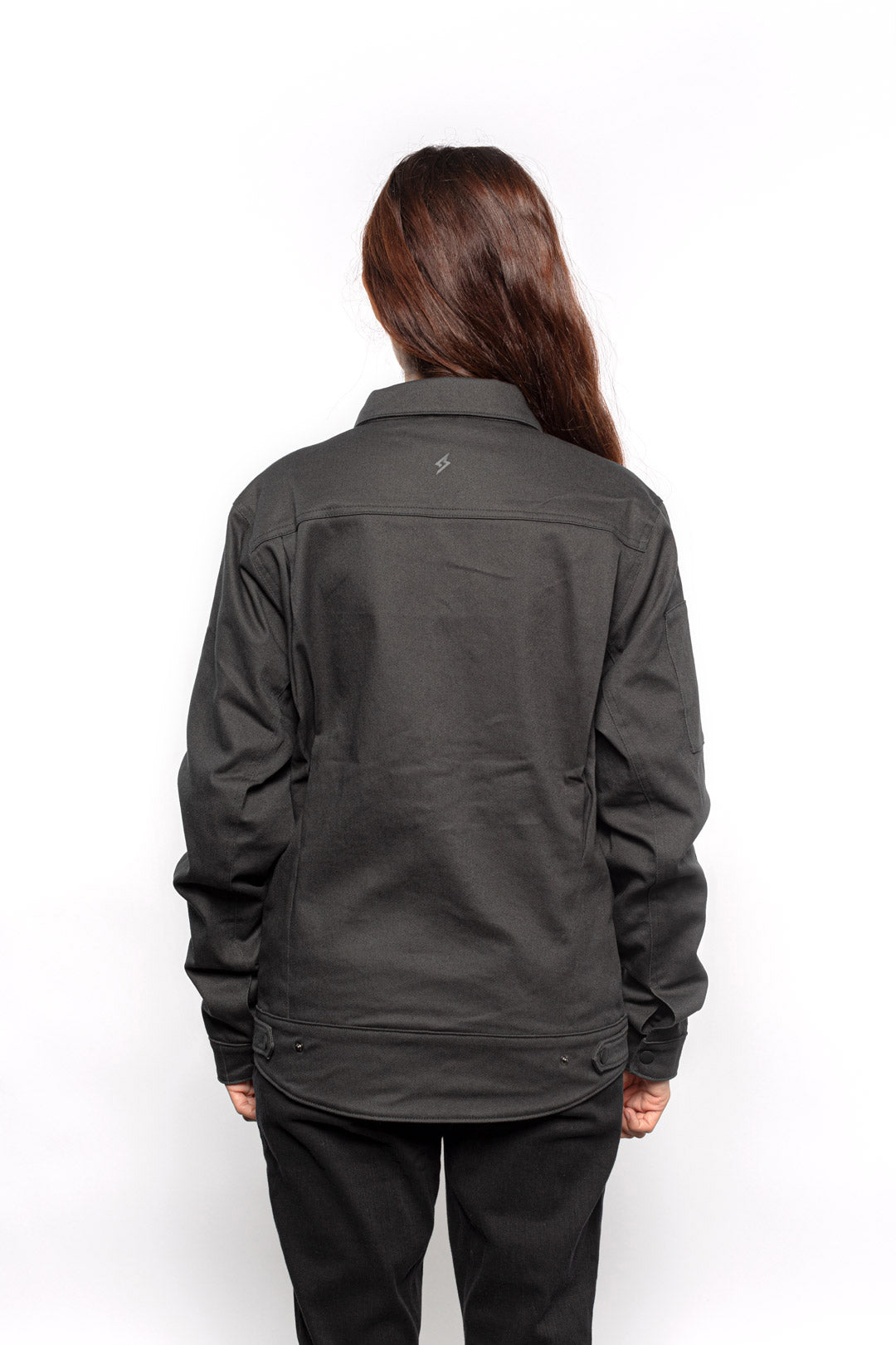 Back view of Female model wearing Anvil Chore Jacket in gravel colorway.