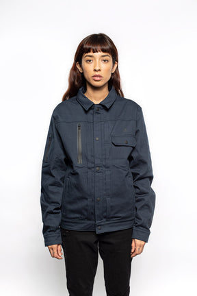 Female model wearing Anvil Chore Jacket in midnight colorway.