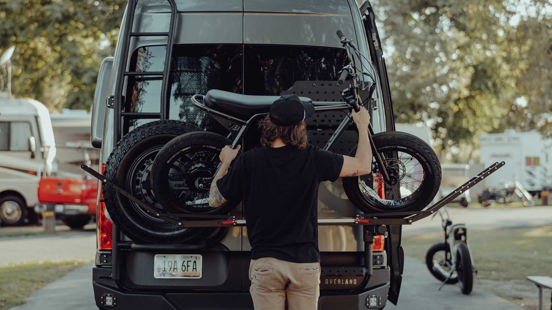 User loading up a Super73-ZX model Ebike onto a 1UP rack.