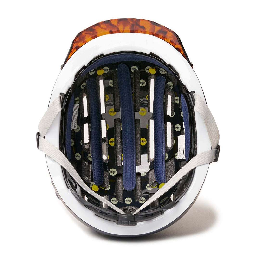 Inside view of Blue Chapter MIPS Helmet by Thousand with tortoise shell visor on white background.