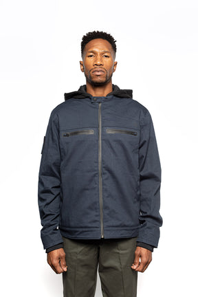 Male model wearing Chisel Hooded Jacket in midnight colorway.