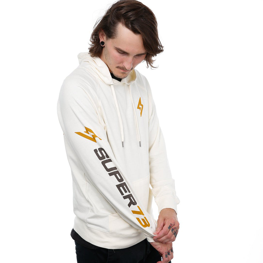 Angle view of male model in Diamond stone hoodie on white background.