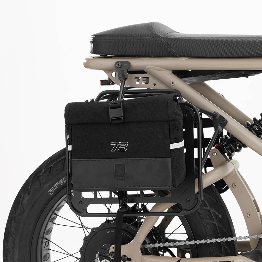 Side profile product image of the R Series Side Rack on bike with Chrome bag attached.