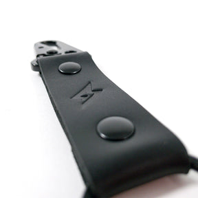 Angle detail view of Super73 leather keychain.