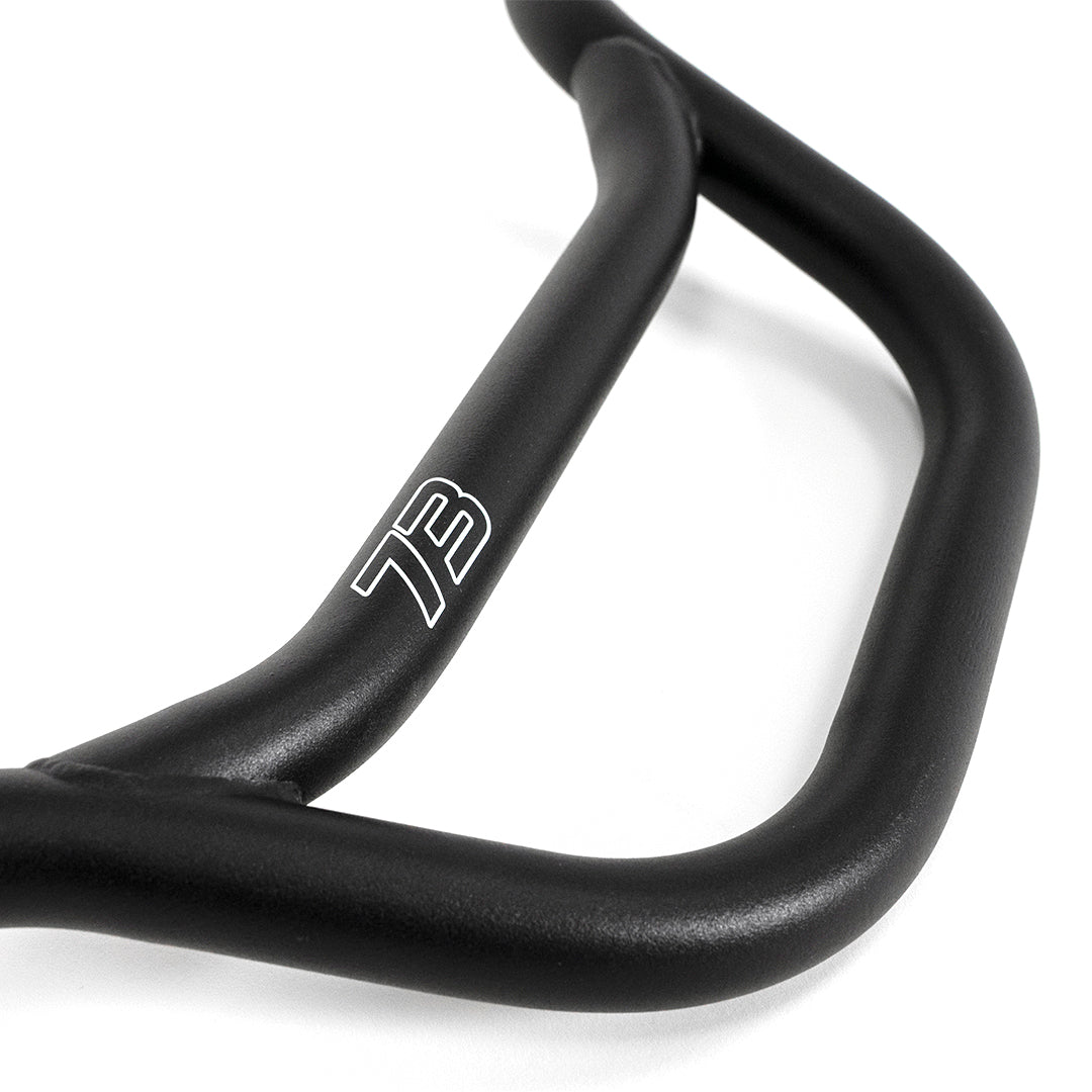 Closeup of the number 73 logo on the handlebar