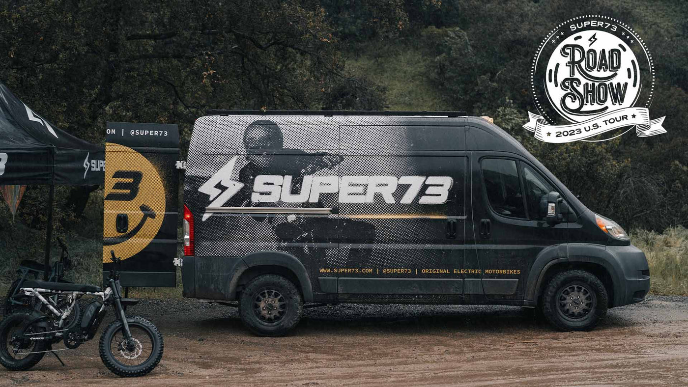 The SUPER73 van setup at an event with the Road Show 2023 US Tour badge overlaid on the image
