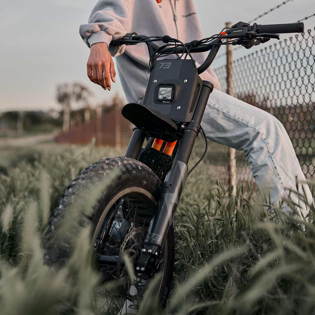 Female rider sitting on her Z Adventure in the sun preparing to go for a daytime ride.