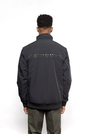 Back view of Male model wearing Royce Harrington Jacket in black colorway.