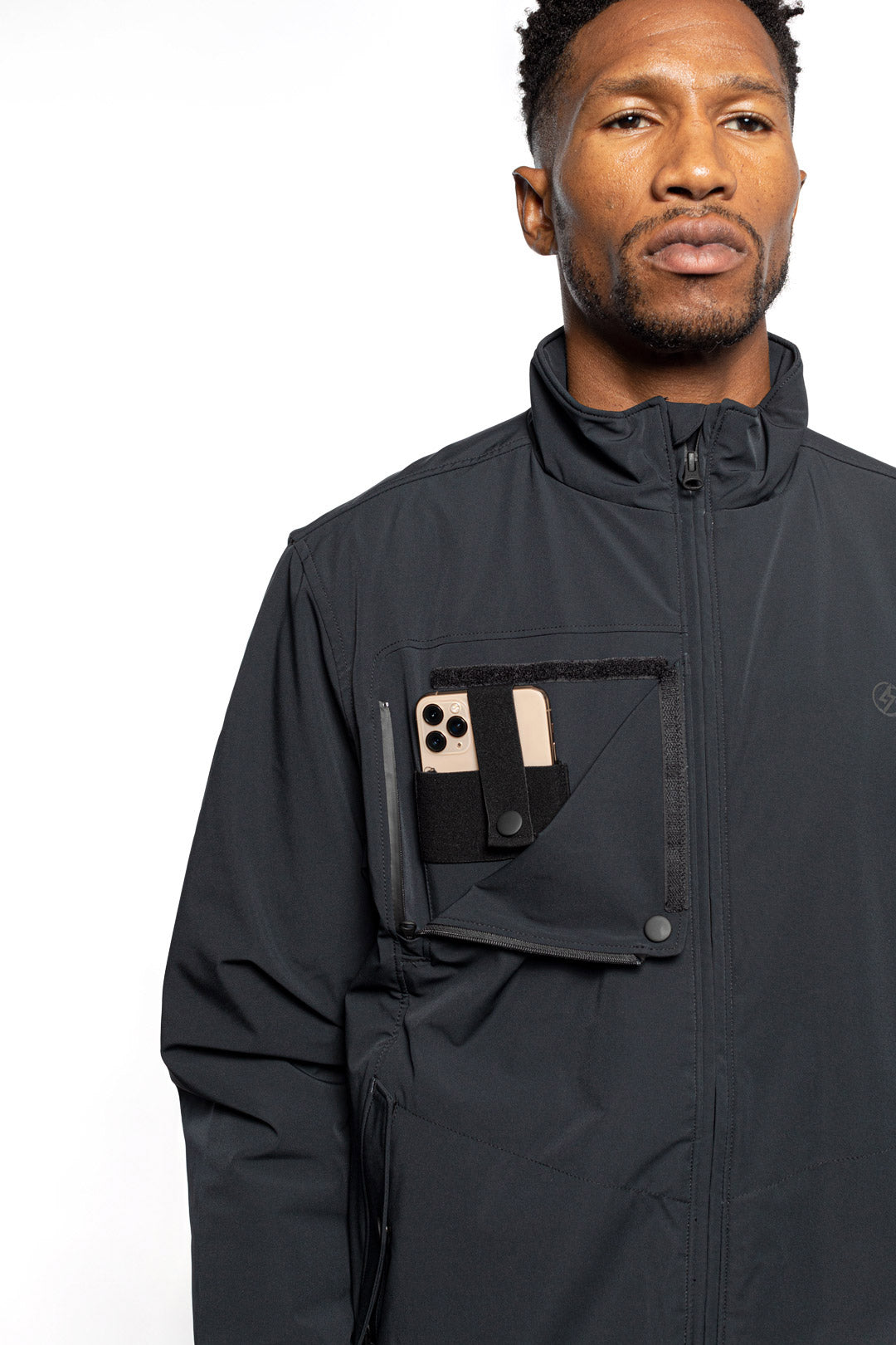 Detail view of Male model wearing Royce Harrington Jacket in black colorway.