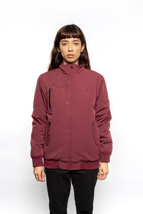 Female model wearing Royce Harrington Jacket in burgundy colorway.