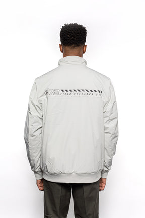 Back view of Male model wearing Royce Harrington Jacket in Chalk colorway.