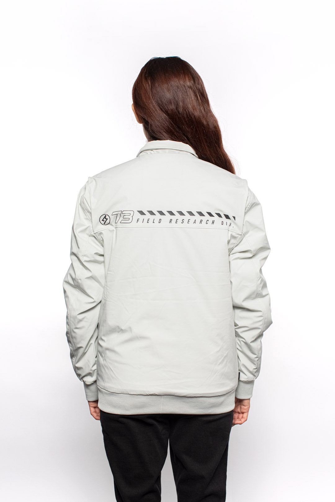 Back view of Female model wearing Royce Harrington Jacket in Chalk colorway.