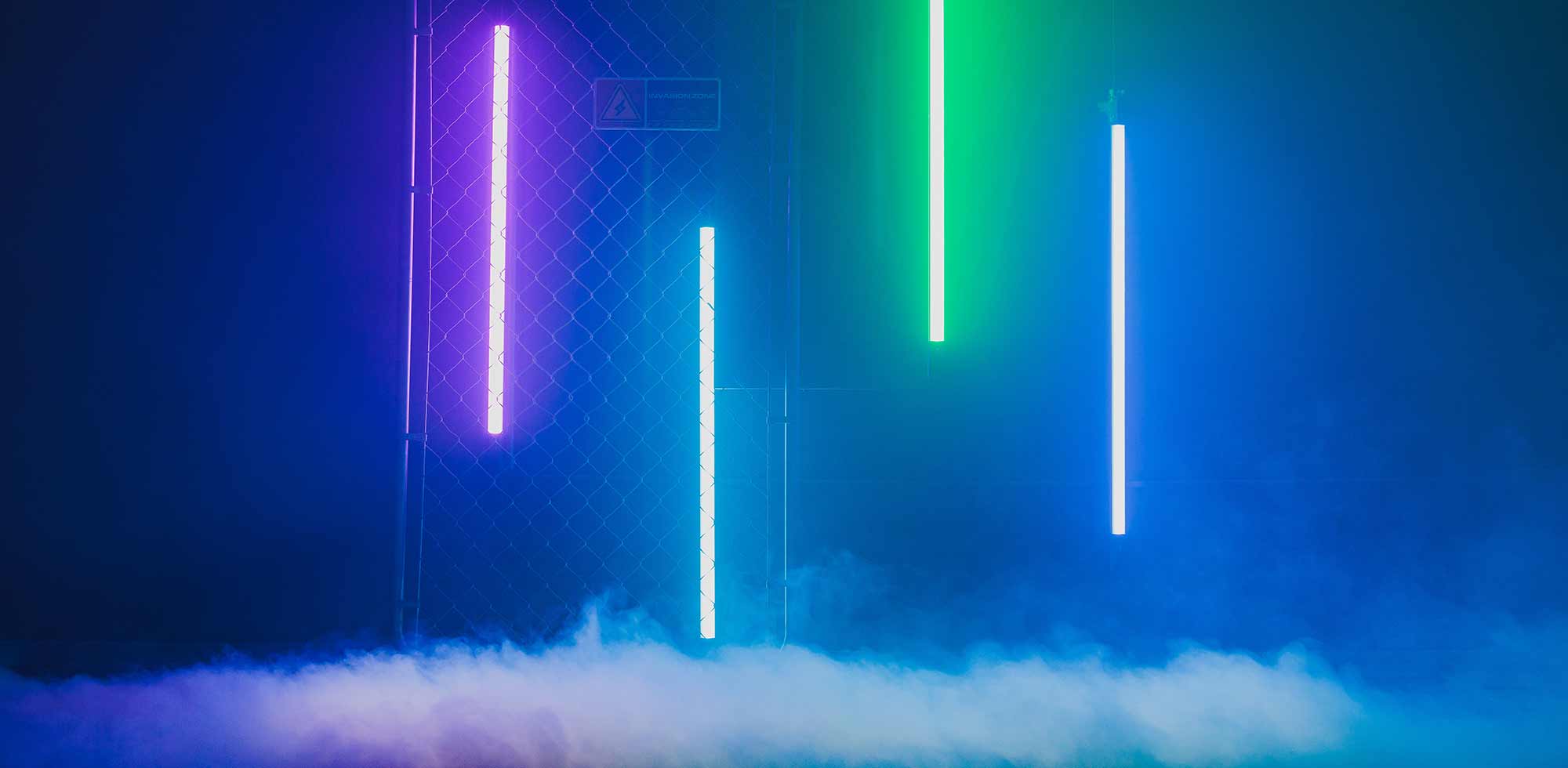 A blue smokey background with neon lights