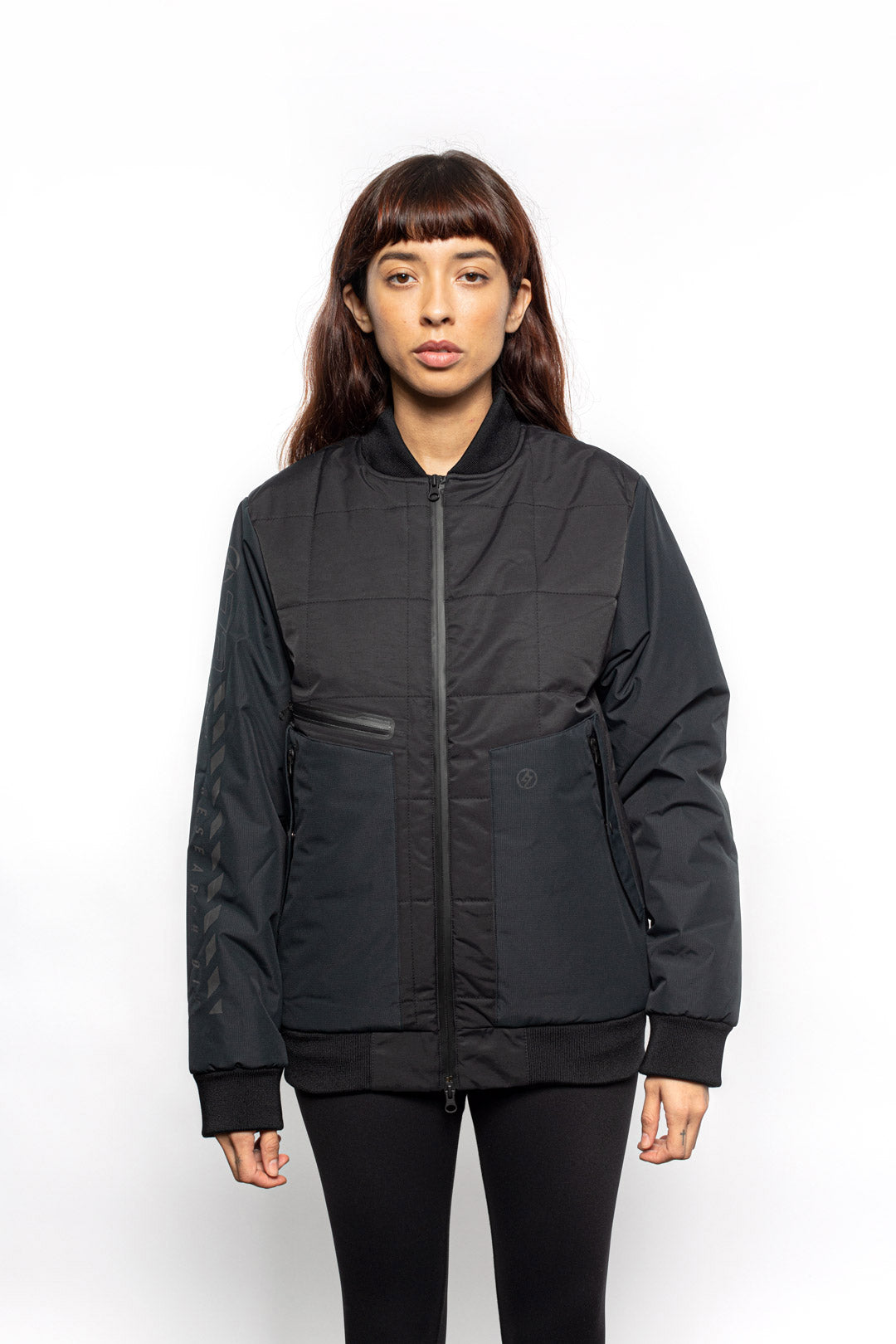 Female model wearing Sipes Varsity Jacket in black colorway.