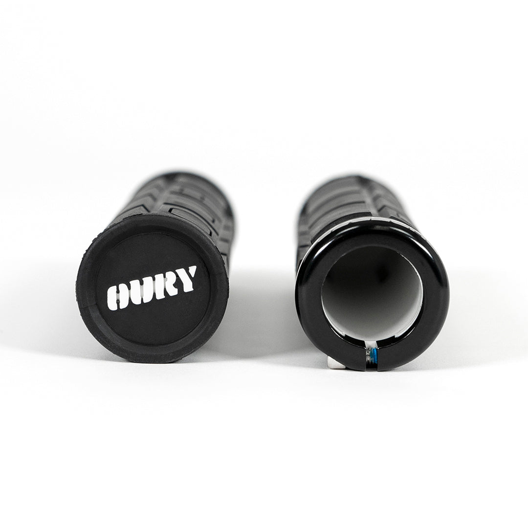 Side view of pair of SUPER73 x Oury Single-Sided Locked-On V2 Grips on white background.
