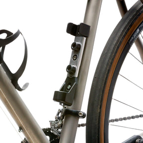 Close up view of TiGr BLUE Mini lock mounted on bike on white background.
