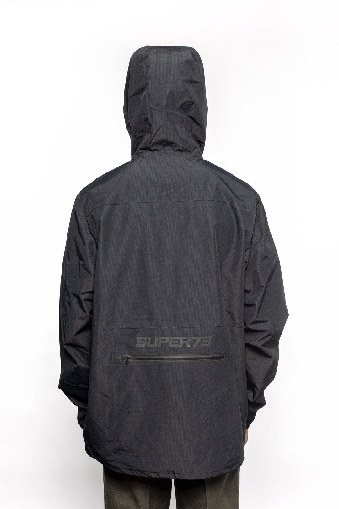 Male model wearing Vale Packable Anorak in black colorway.