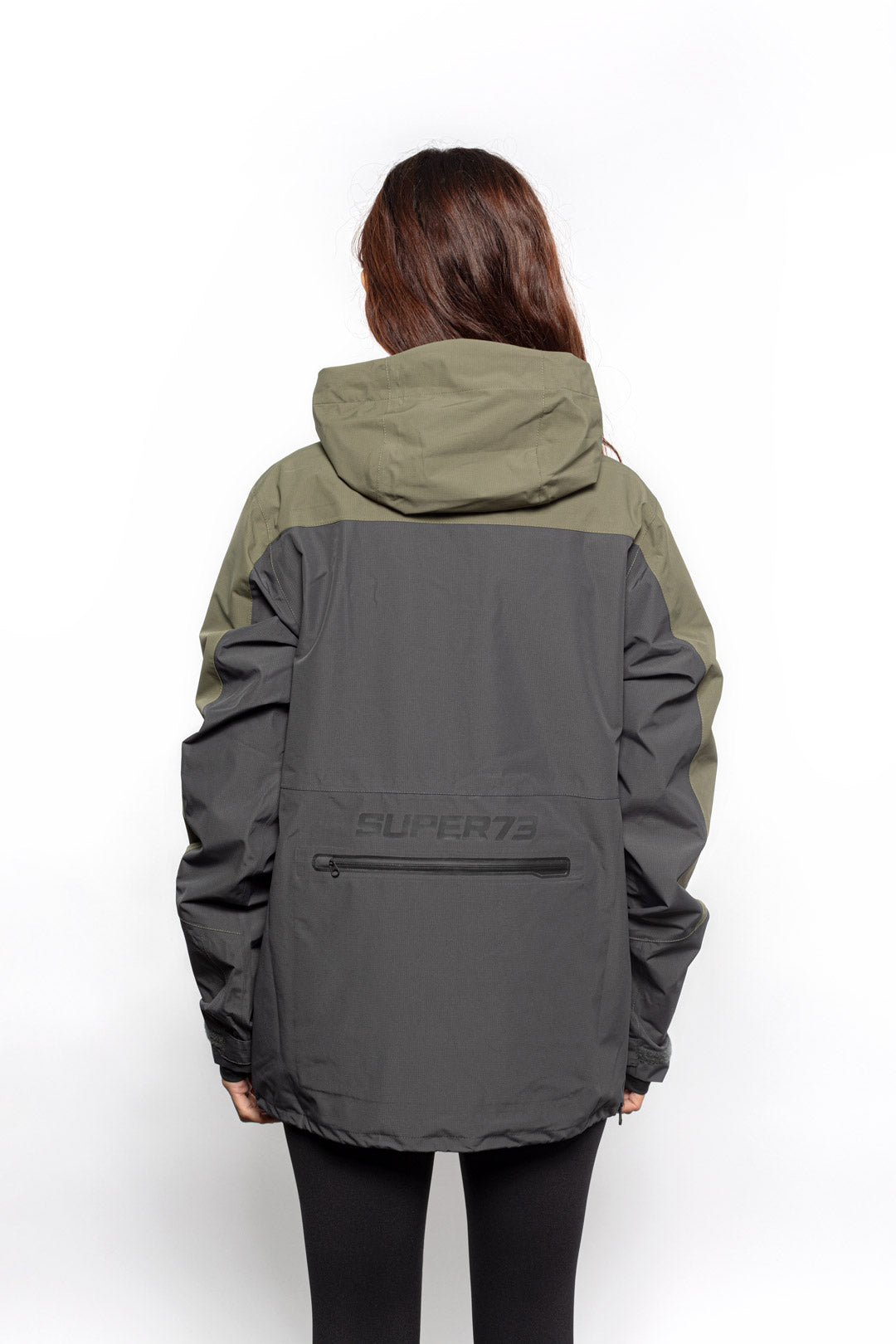 Back view of Female model wearing Vale Packable Anorak in Dark Fatigue colorway.